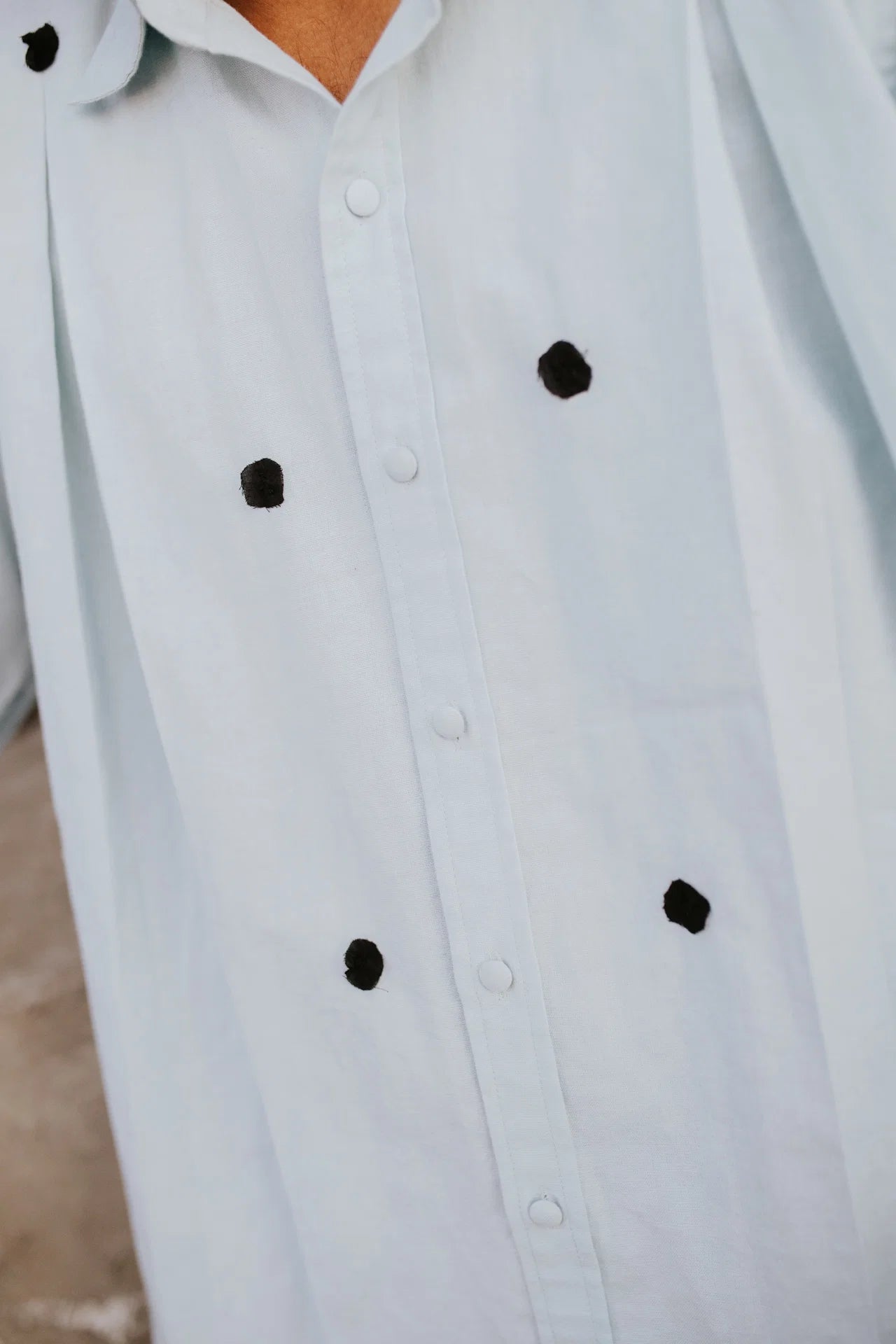 Black Knots on Blue Shirt